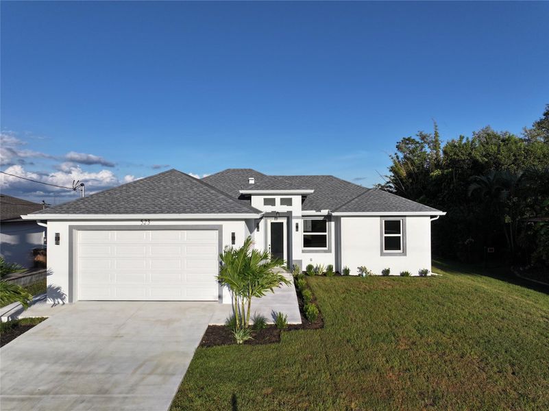 Front exterior of a new home in , Cape Coral, FL, highlighting curb appeal (Image 1). Front exterior of a new home in , Cape Coral, FL, highlighting curb appeal (Image 1).