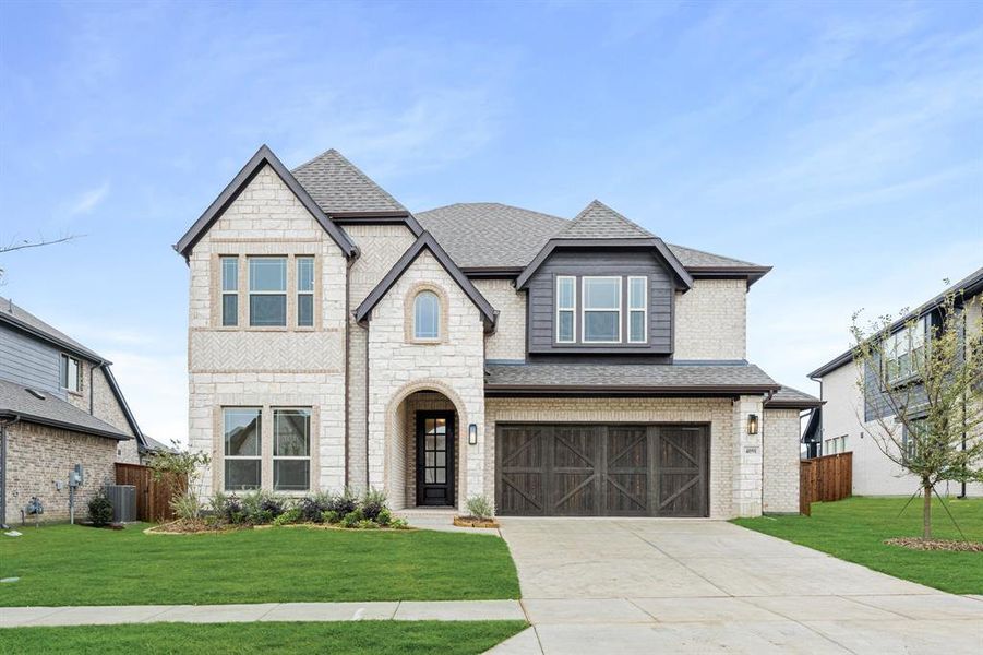 Front exterior of a new home in Windsong Ranch Classic 61, Prosper, TX, highlighting curb appeal (Image 27).