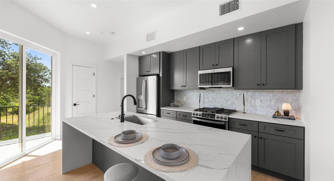 The modern front elevation delivers standout curb appeal and a warm welcome home. Model No. 105 Shown.