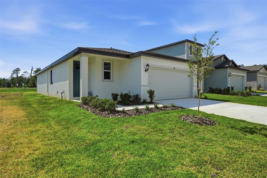 Front exterior of a new home in Leyland Preserve - Premier Series, Brooksville, FL, highlighting curb appeal (Image 33).