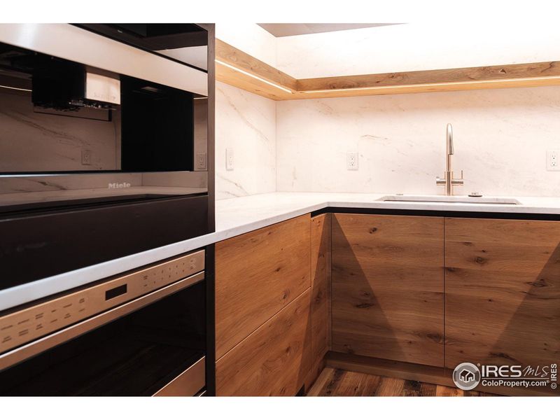 Cook in Buttler's Pantry with full sink, Miele built in coffee maker, refrigerated beverage drawers, microwave and ample s