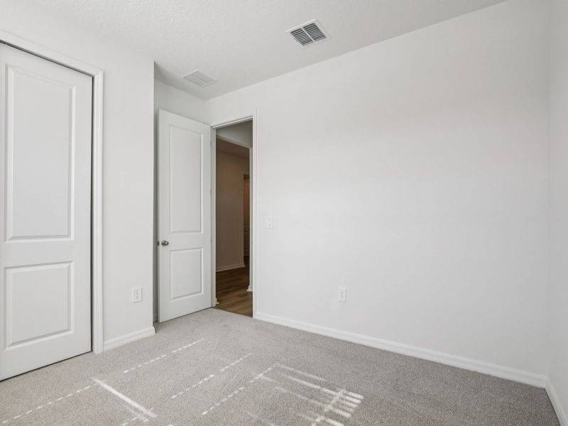 Spacious, unfurnished interior of a new home in Coasterra - Reserve Series, Palmetto (Image 15).