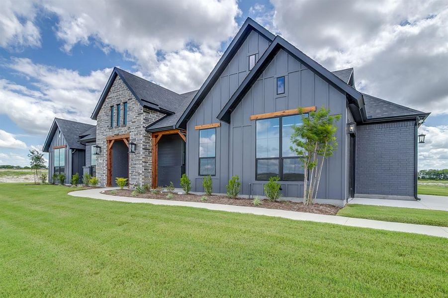 Front exterior of a new home in Peaks at Lone Elm, Waxahachie, TX, highlighting curb appeal (Image 2). Front exterior of a new home in Peaks at Lone Elm, Waxahachie, TX, highlighting curb appeal (Image 2).