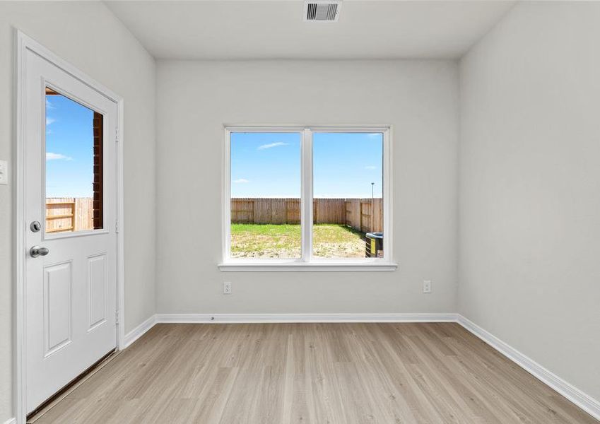 The dining room overlooks the private backyard