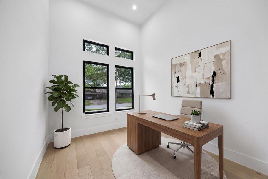 Quiet and out of the way, the separate Study (or formal Living or kids play area) with a 14 foot ceiling. It has a view to the front of the house and also has double Pella French doors out to the central, turfed court yard. (virt. staged)