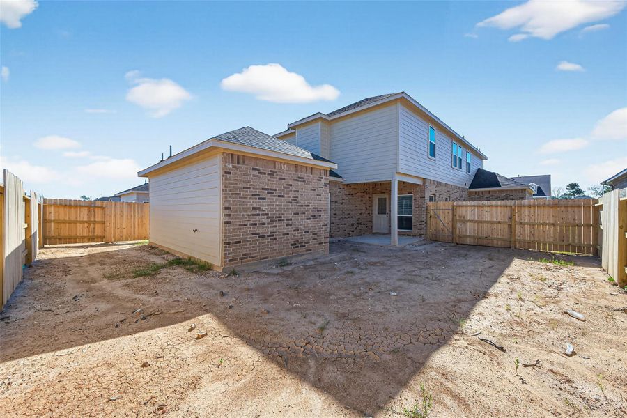 Exterior details and patio area of a home in Enclave at Willis, Willis (Image 22).