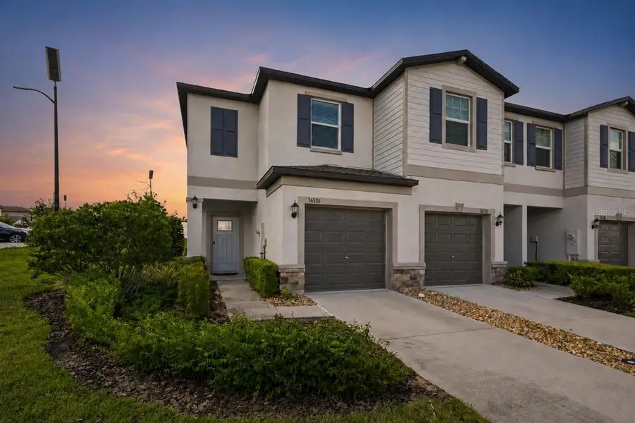 Front exterior of a new home in , Zephyrhills, FL, highlighting curb appeal (Image 1). Front exterior of a new home in , Zephyrhills, FL, highlighting curb appeal (Image 1).