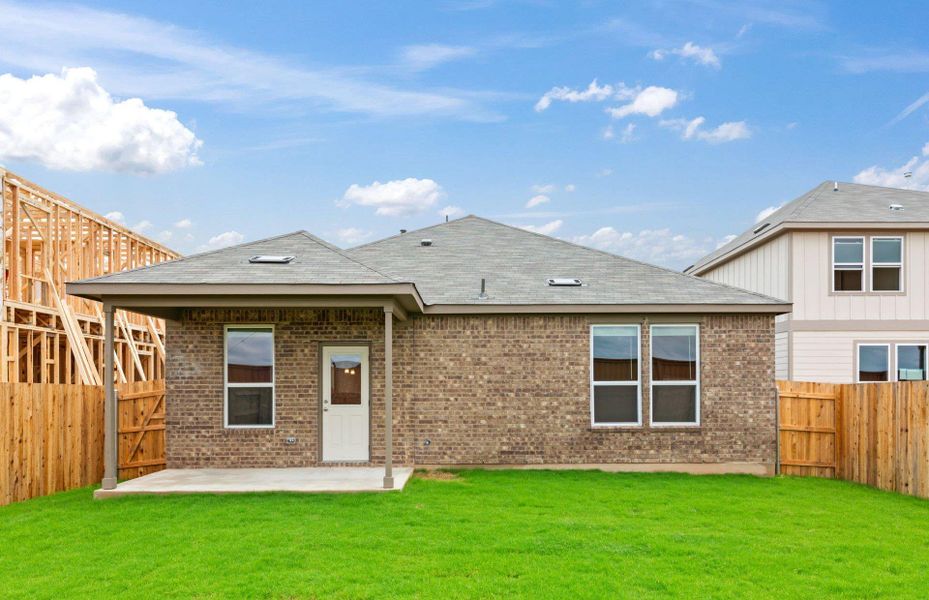Front exterior of a new home in Sunfield, Buda, TX, highlighting curb appeal (Image 12). Front exterior of a new home in Sunfield, Buda, TX, highlighting curb appeal (Image 12).
