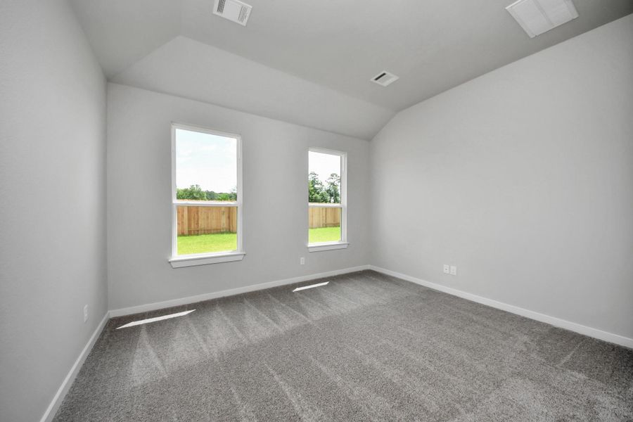 Escape and relax in the exquisite primary suite, a haven to unwind after a long day. The spacious room, located on first floor, boasts plush carpeting, soothing paint tones, high ceilings, and expansive windows adorned with privacy blinds. Escape and relax in the exquisite primary suite, a haven to unwind after a long day. The spacious room, located on first floor, boasts plush carpeting, soothing paint tones, high ceilings, and expansive windows adorned with privacy blinds.