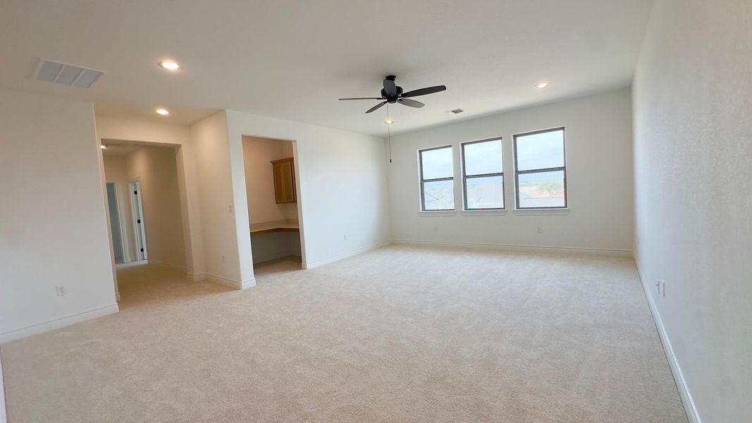 Empty room with light carpet, recessed lighting, and a ceiling fan
