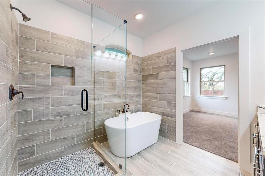 Bathroom with vanity and plus walk in shower