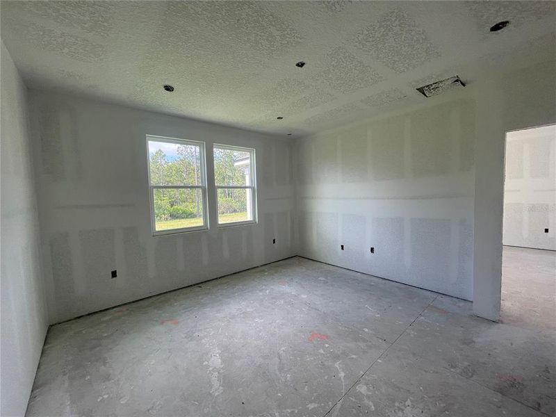 Spacious, unfurnished interior of a new home in Palm Series at Seminole Palms, Palm Coast (Image 19).
