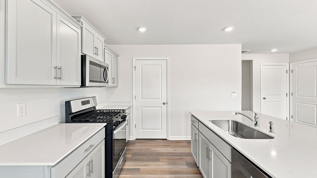 Furnished interior view inside a new home in Bentley Park, Greenwood (Image 9).