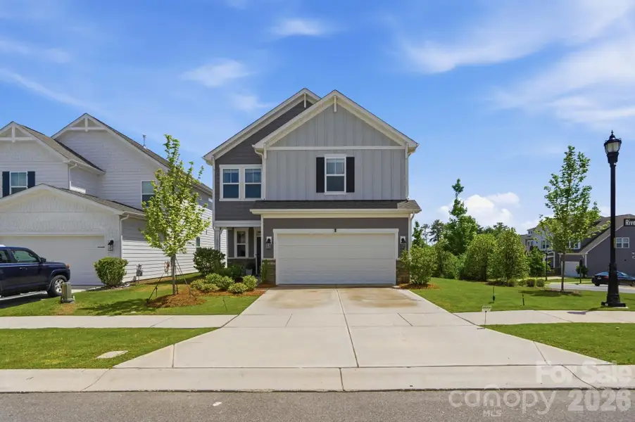 Front exterior of a new home in , Charlotte, NC, highlighting curb appeal (Image 22).