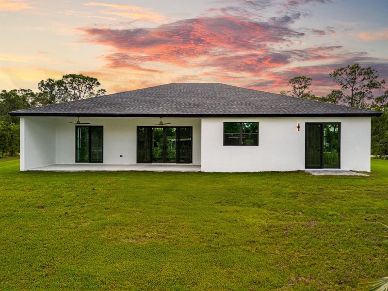 Exterior details and patio area of a home in , The Acreage (Image 1).