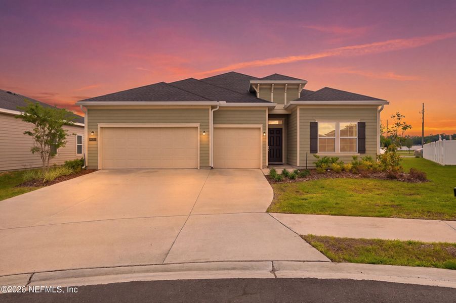 Front exterior of a new home in Saddle Oaks, Jacksonville, FL, highlighting curb appeal (Image 1). Front exterior of a new home in Saddle Oaks, Jacksonville, FL, highlighting curb appeal (Image 1).