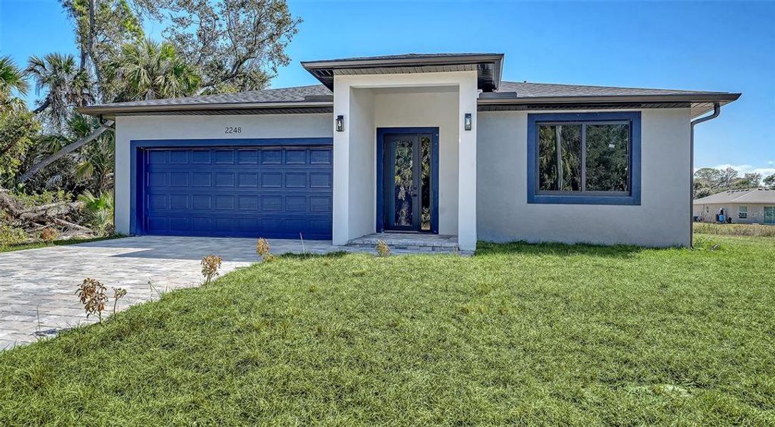 Front exterior of a new home in , North Port, FL, highlighting curb appeal (Image 18).
