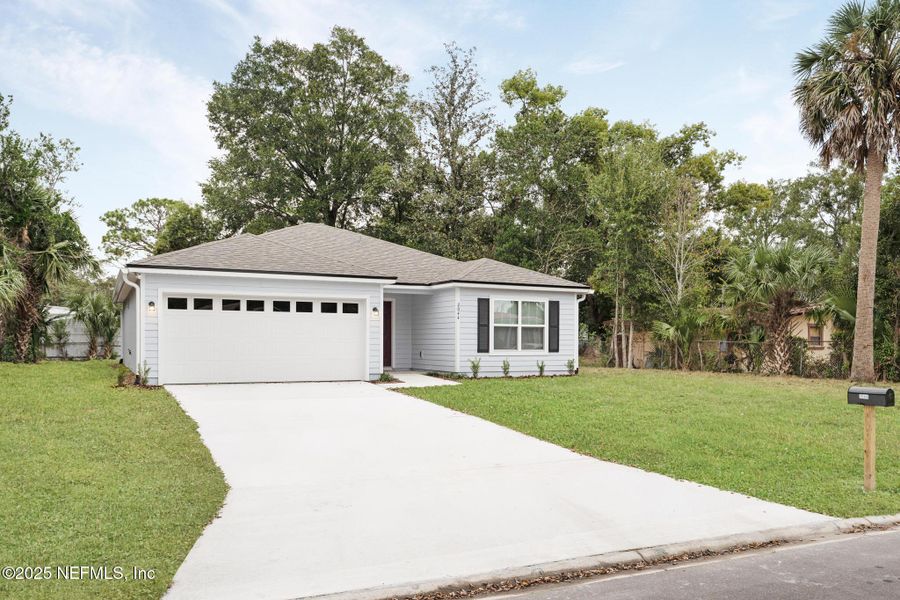 Front exterior of a new home in , Jacksonville, FL, highlighting curb appeal (Image 2).