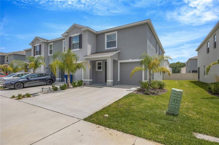 Front exterior of a new home in , Wesley Chapel, FL, highlighting curb appeal (Image 22).