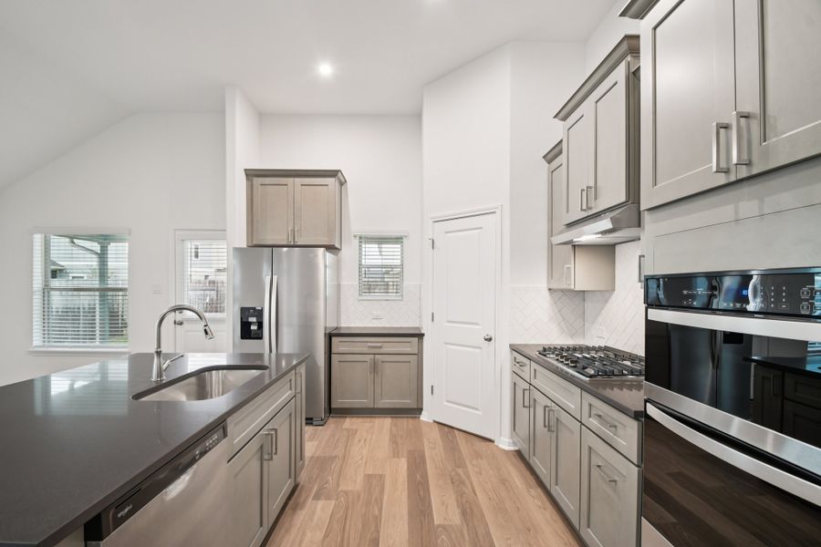 Furnished interior view inside a new home in Crosswinds, Kyle (Image 6).