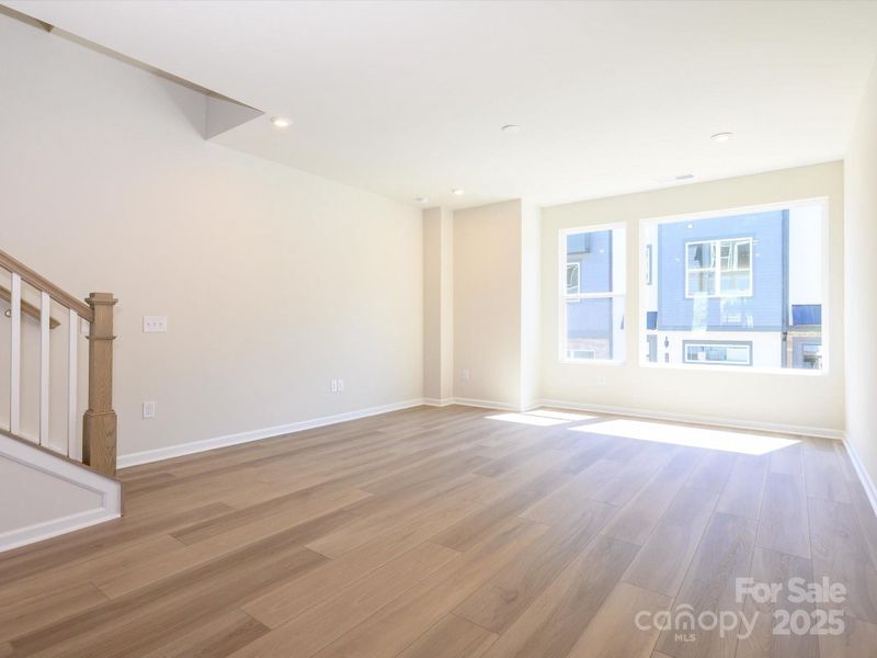 Warmth and light is pulled into this great room through large energy efficient windows.
