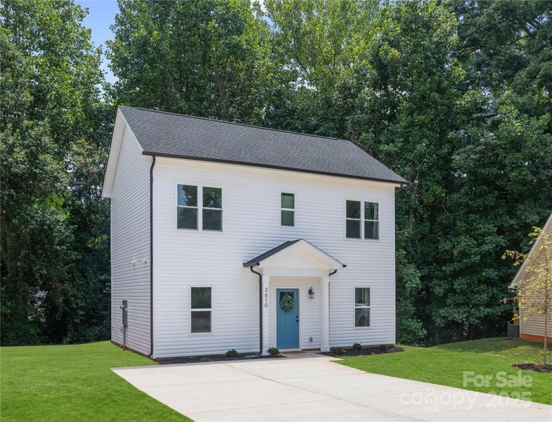 Front exterior of a new home in , Charlotte, NC, highlighting curb appeal (Image 1).