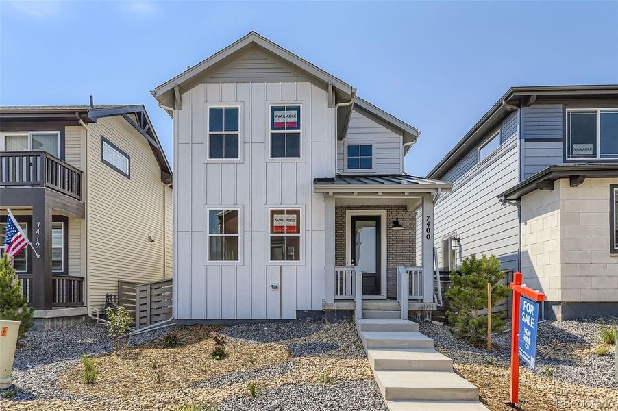 Front exterior of a new home in The Villas Collection at Sterling Ranch, Littleton, CO, highlighting curb appeal (Image 1).