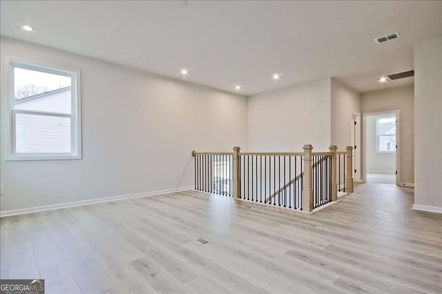 Spacious, unfurnished interior of a new home in The Paddocks at Doc Hughes, Buford (Image 44).