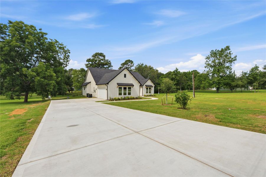 Front exterior of a new home in , Dayton, TX, highlighting curb appeal (Image 2). Front exterior of a new home in , Dayton, TX, highlighting curb appeal (Image 2).