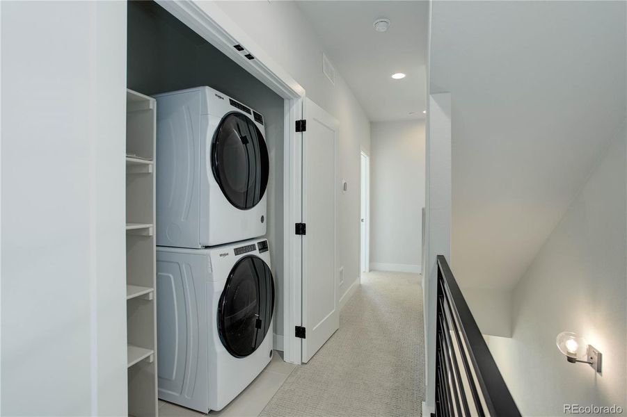 Main level powder bath tucked behind the dining room, next to the coat closet