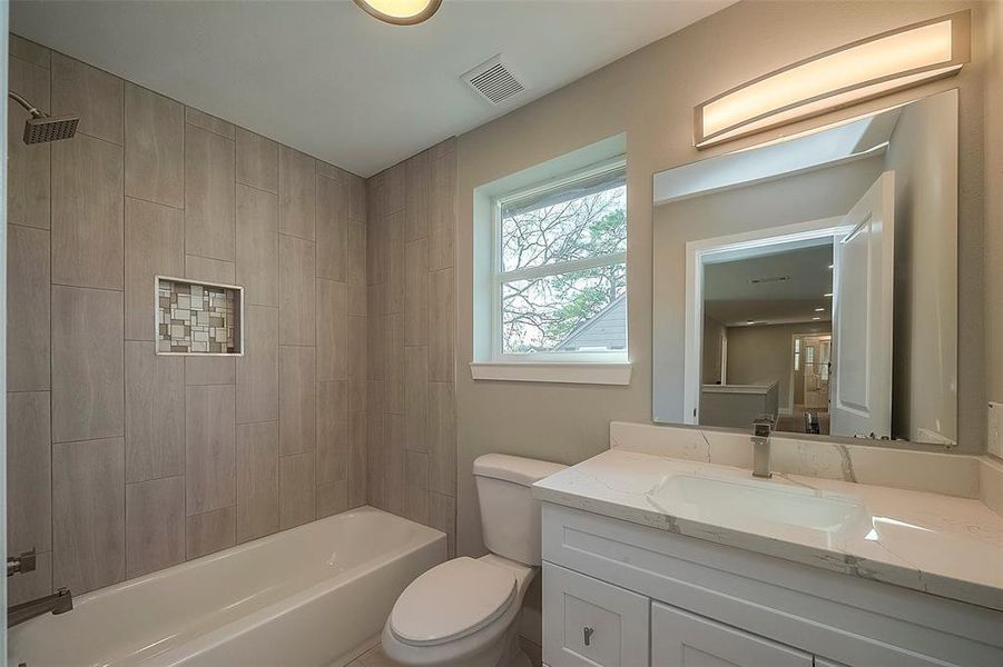 Hall bathroom with tub to ceiling tile