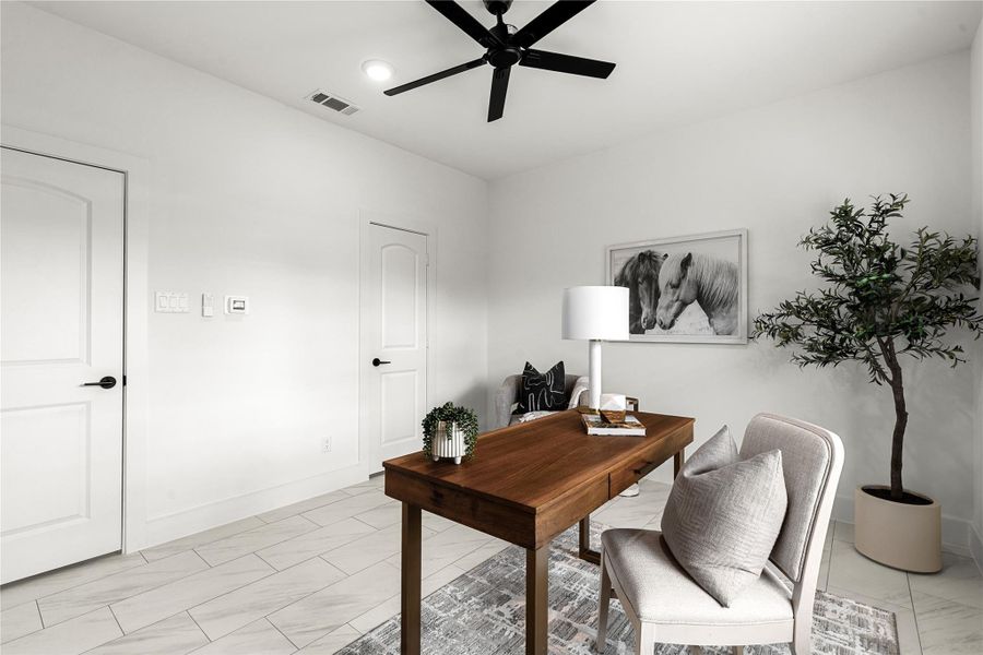 Versatile bedroom featuring spacious walk-in closet - perfect as a guest bedroom or home office. Sleek tile floors and modern finishes complete the polished look.
