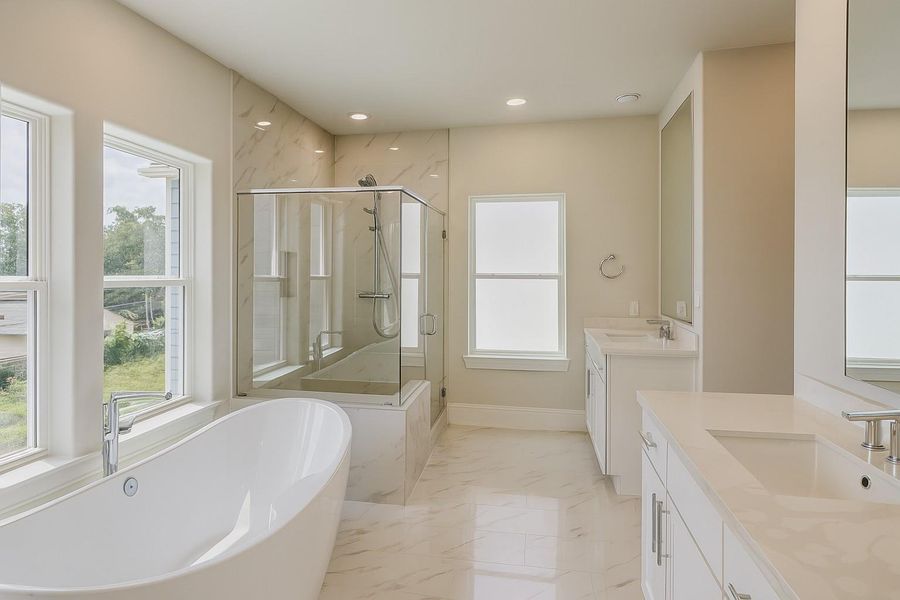 Even the bathroom has great natural light!  Free Standing Tub, Seated Shower, Split Vanities
