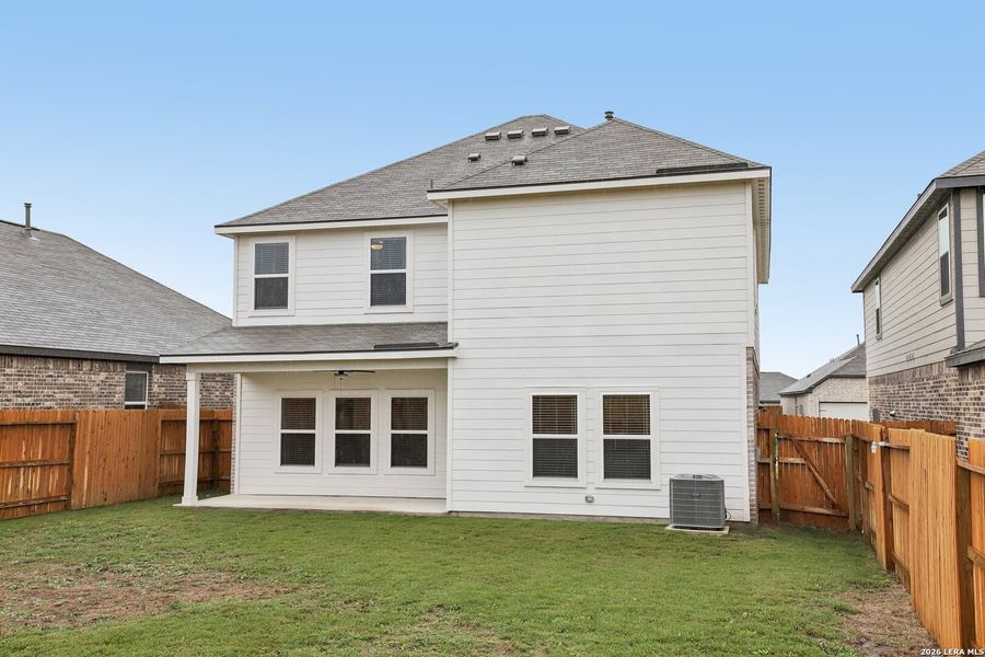 Exterior details and patio area of a home in Hightop Ridge, Converse (Image 25).