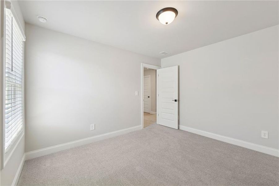 Spacious, unfurnished interior of a new home in Vines at Mill Creek - Estate Series, Braselton (Image 43).