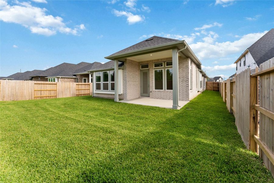 Exterior details and patio area of a home in Ellwood, Iowa Colony (Image 19).
