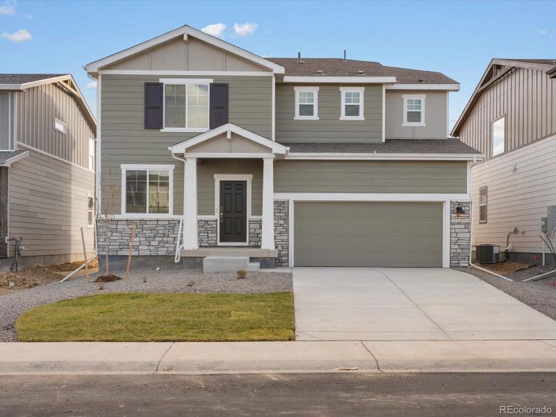 Front exterior of a new home in Revere at Johnstown, Johnstown, CO, highlighting curb appeal (Image 1).