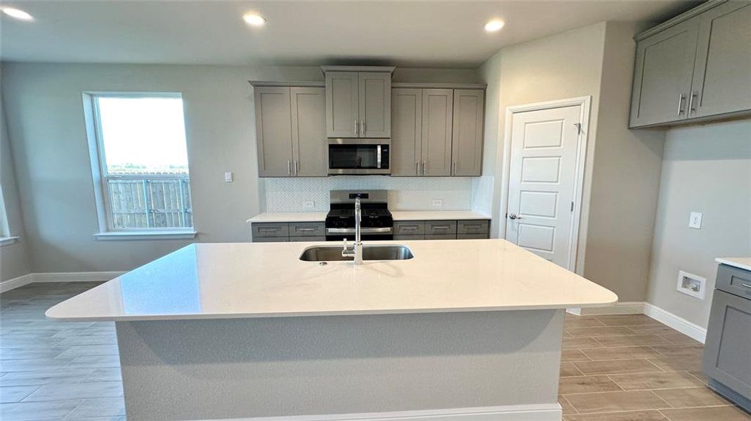 Kitchen - All Home and community information, including pricing, included features, terms, availability and amenities, are subject to change at any time without notice or obligation. All Drawings, pictures, photographs, video, square footages, floor plans, elevations, features, colors and sizes are approximate for illustration purposes only and will vary from the homes as built. Kitchen - All Home and community information, including pricing, included features, terms, availability and amenities, are subject to change at any time without notice or obligation. All Drawings, pictures, photographs, video, square footages, floor plans, elevations, features, colors and sizes are approximate for illustration purposes only and will vary from the homes as built.