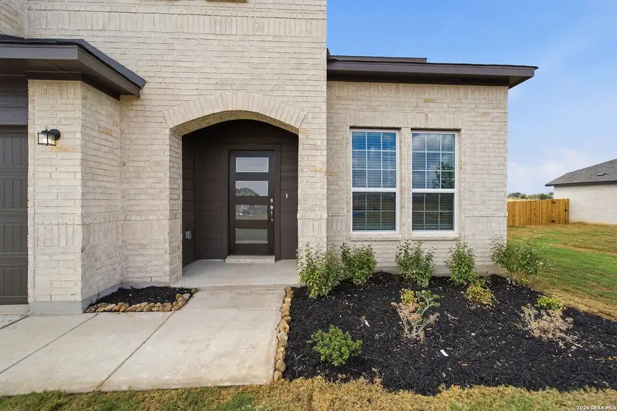 Exterior details and patio area of a home in Hickory Ridge, Elmendorf (Image 4).