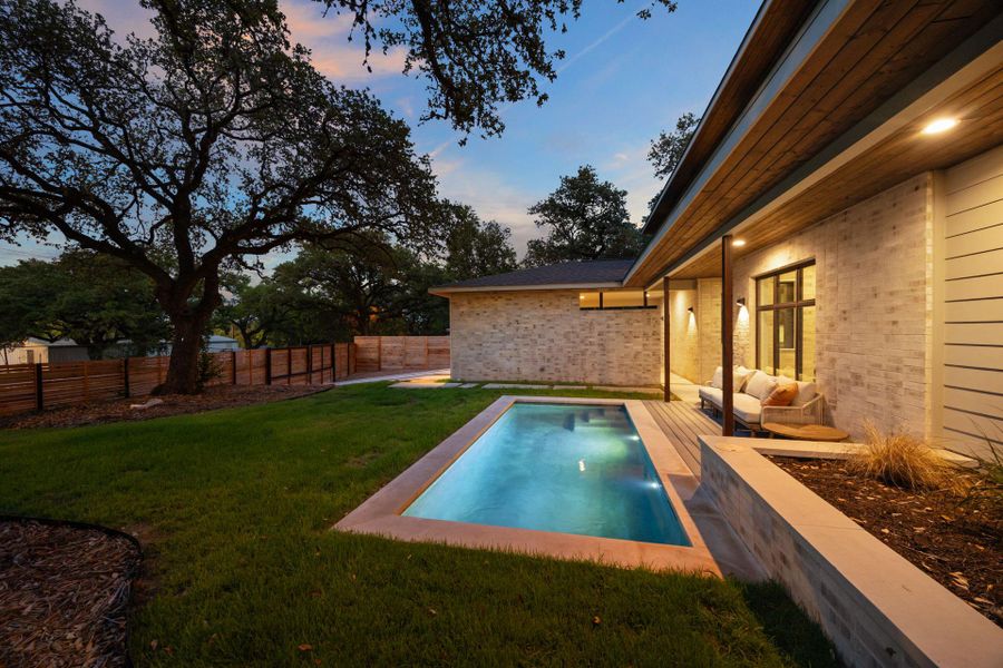 View of swimming pool featuring a fenced backyard and a patio