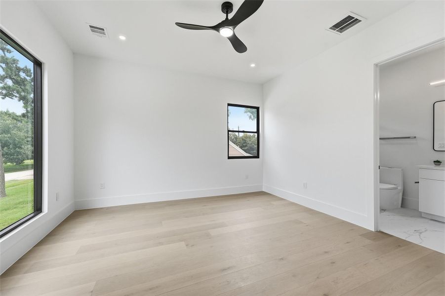 Upstairs bedroom two offers generous proportions, abundant natural light