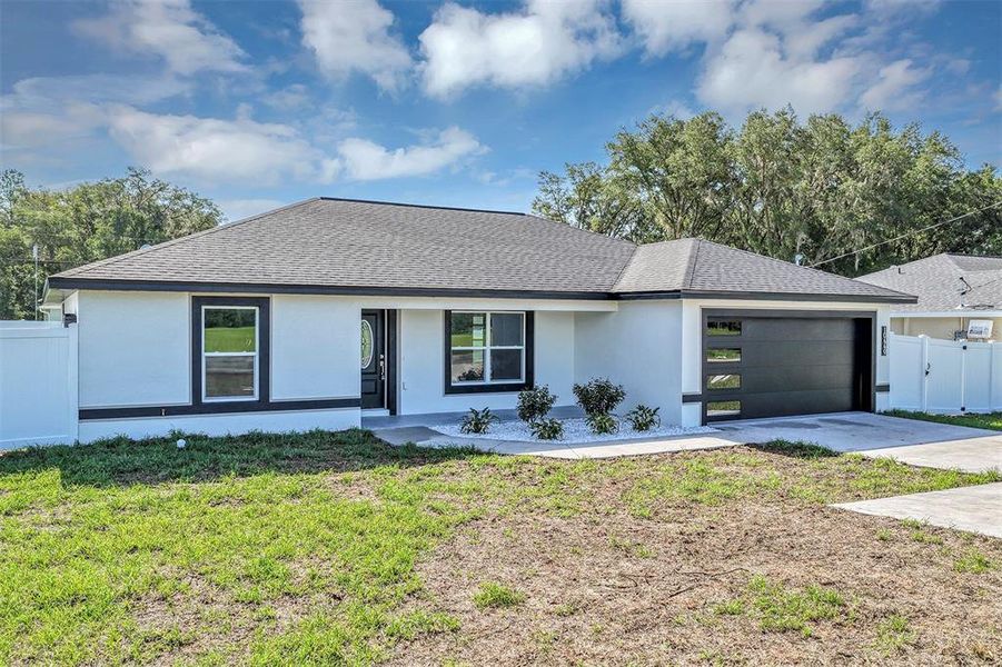 Front exterior of a new home in , Dunnellon, FL, highlighting curb appeal (Image 2). Front exterior of a new home in , Dunnellon, FL, highlighting curb appeal (Image 2).