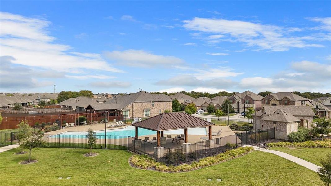 Community pool featuring a patio, a residential view, and a gazebo