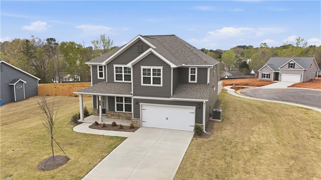 Front exterior of a new home in , Commerce, GA, highlighting curb appeal (Image 29).