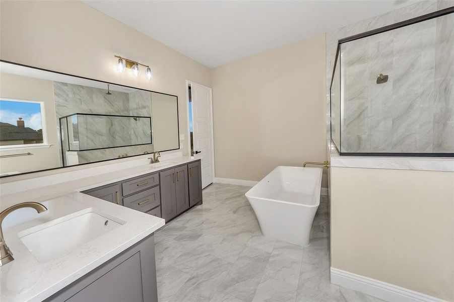 Bathroom with vanity and independent shower and bath