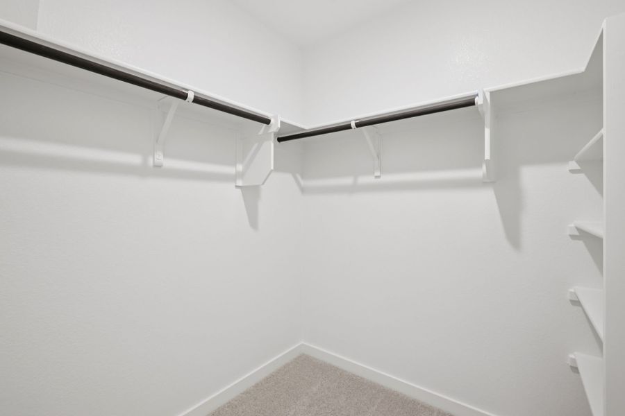 A white staircase with a metal railing.