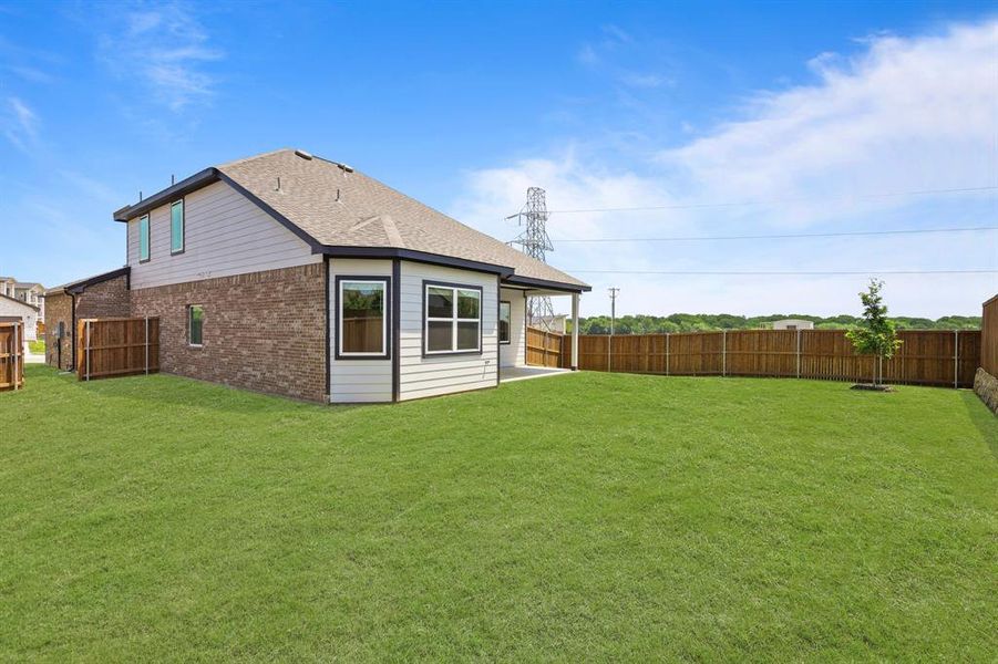 Front exterior of a new home in Burgess Meadows, Cleburne, TX, highlighting curb appeal (Image 2). Front exterior of a new home in Burgess Meadows, Cleburne, TX, highlighting curb appeal (Image 2).