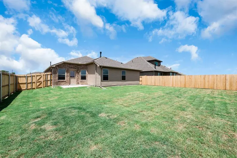 Exterior details and patio area of a home in Fox Landing, Caddo Mills (Image 4).