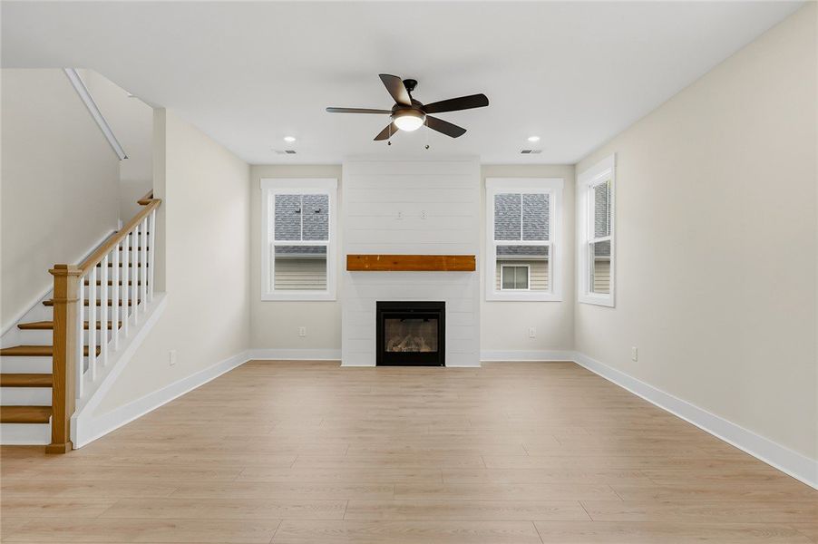 An inviting fireplace anchor this light-filled roo