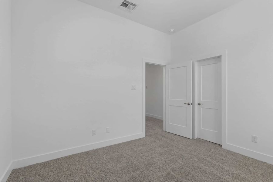 Representative unfurnished interior of a home built from the Waterford by Chesmar Homes in Meridiana 60's, Manvel (Image 39).